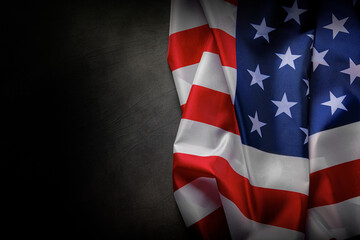 American flag with stars and stripes on a dark textured background