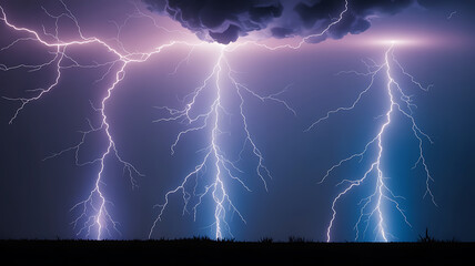Powerful lightning strikes against a dark sky.

