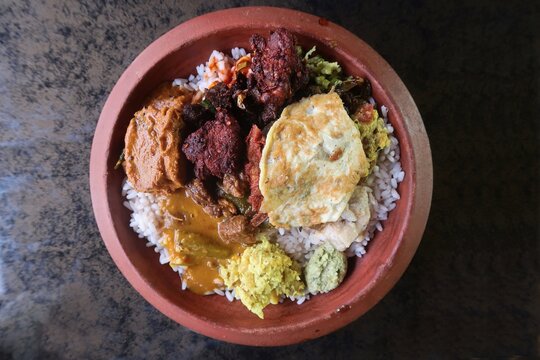 chattichoru, a traditional kerala, indian dish, refers to rice cooked and served in an earthen pot chatti. It's a complete meal featuring rice, various curries including fish ,chicken , and beef