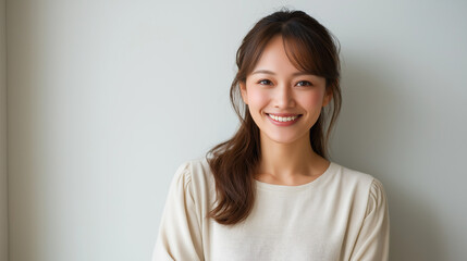 Portrait of a smiling Japanese woman with clear skin and natural makeup