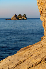 Beautiful seascape in morning with sea view and islands with small church on top of cliff. The Sveta Nedelya and Katic Islands, near Petrovac city, Montenegro