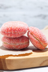 Liberales with sugar served on a light wooden board, neutral background, and home kitchen...