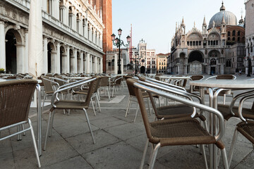 Naklejka premium Empty Outdoor Café in St. Mark's Square, Venice in the Morning Light