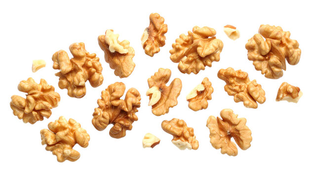 Floating Walnut Halves and Pieces isolated on white background 