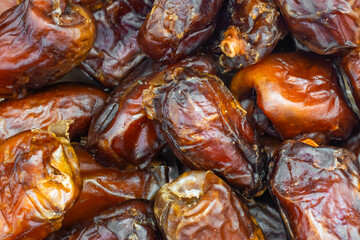brown dried dates. background or texture