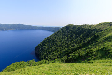 Majestic Lake Surrounded by Verdant Hills