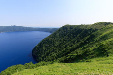 Majestic Lake Surrounded by Verdant Hills