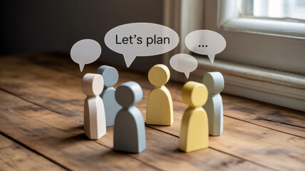 Diverse group of wooden figures in a circle discussing ideas with speech bubbles above their heads