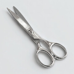 Fototapeta premium A shiny stainless steel pair of scissors, placed on a white desk, ready for precision cutting tasks.
