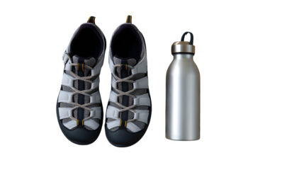 Outdoor trekking sandals placed beside mini rocks and water bottle, hiking gear flat lay, isolated,