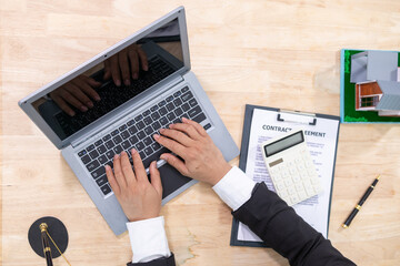 Real estate businessman or broker is calculating interest rate based on the period of time that the client wants to use in deciding to make a contract to buy a real estate. Real estate trading concept