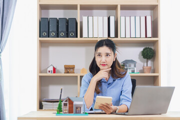 Real estate businessman or broker is calculating interest rate based on the period of time that the client wants to use in deciding to make a contract to buy a real estate. Real estate trading concept