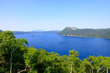 Obraz premium Lake Mashu, Panoramic View of Serene Blue Lake in Hokkaido's Caldera