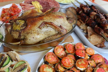 table setting for a festive dinner, grilled duck and appetizers