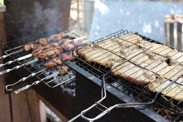 cooking barbecue outdoors on a grill
