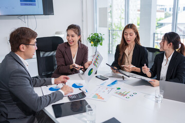 Group of Asian business people meeting and presenting work in the office
