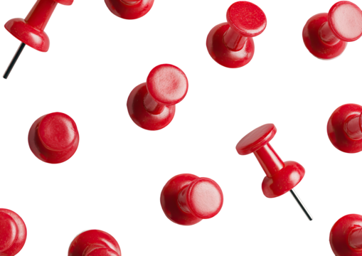 Red pushpins scattered on black background