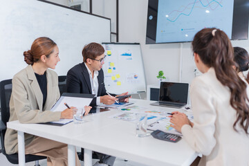 Group of Asian businesspeople are having a meeting.