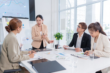 Group of Asian business people meeting and presenting work in the office