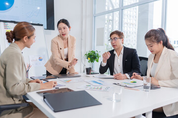 Group of Asian businesspeople are having a meeting.