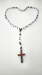 Rosary with Wooden Cross – Symbol of Faith on White Background