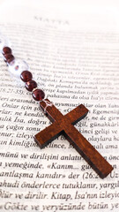 Wooden Rosary Cross on Turkish Written Christian Bible