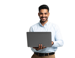 An attractive Indian man smiling and using a laptop on a white table, isolated on transparent background.