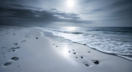 Seascape with Footprints and Waves on Sandy Beach in Monochrome Tone