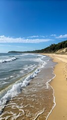 Obraz premium June on the Coastline A Serene Seascape of Blue Sky and Gentle Waves Greeting the Sandy Beach.