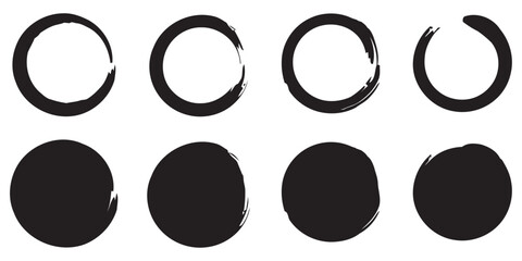 Collection of eight abstract black ink circles and brush stroke rings silhouette isolated on white background