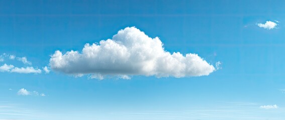 Single cumulus cloud against a vibrant blue sky
