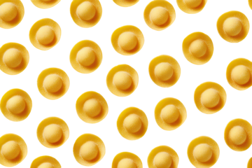 Close-up of small, pale yellow pasta, in a repeating pattern against black