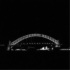 Fototapeta premium Sydney Harbour Bridge bathed in dawn light in Sydney at midnight with glowing lanterns