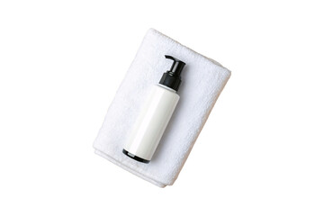 White pump bottle with black dispenser on folded towel, spa aesthetic, minimalist design, isolated on a transparent background