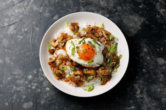 Hawaiian Loco Moco with hamburger, fried egg and brown mushroom gravy