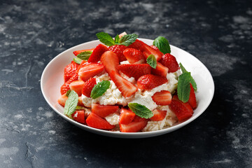 Traditional english dessert eton mess with meringue, whipped cream and fresh strawberries