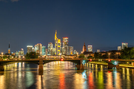 Illuminated Frankfurt City Downtown, Ignatz Bubis Bridge and Main River at Night. Hesse, Germany