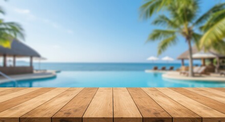 Fototapeta premium Blank wooden table against blur tropical resort background with pool and palm trees. Showcase for product display or advertisement on summer vacation theme for banner or poster with empty space.