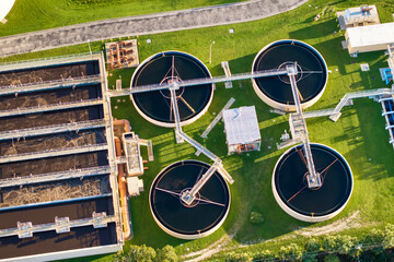 Industrial water treatment facility with water cleaning cisterns and piping system