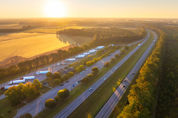 Large truck stop rest area on interstate freeway for trucks overnight parking. Recreational place during long traveling