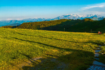 Alpine summer evening view with a far view of the Hohe Tauern mountains seen from Mount Asitz, Leogang, Zell am See, Pinzgau, Salzburg, Austria