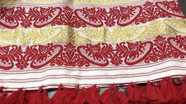 Close up shot of Assamese Gamosaof Assam with floral design ,Bihu Gamosa 