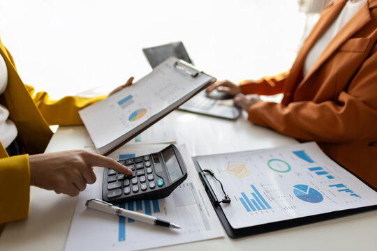 Businesswoman meeting with consultant discussing financial situation analysis in business and marketing report. Financial planning, accounting and business strategy.