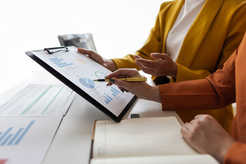 Businesswoman meeting with consultant discussing financial situation analysis in business and...