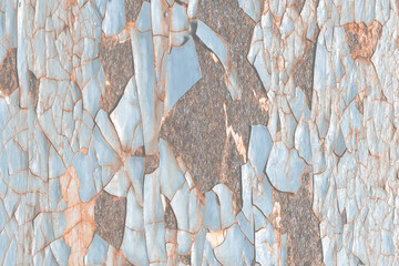 Texture of rusty metal with peeling enamel. Rough surface of painted metal with rust. Corroded and...