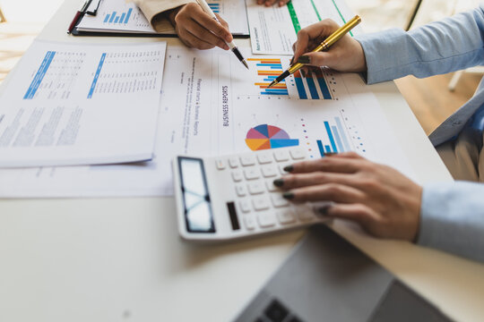 Auditor working in the office. Businesswoman meeting with consultant discussing financial situation analysis in business and marketing report. Financial planning, accounting and business strategy.