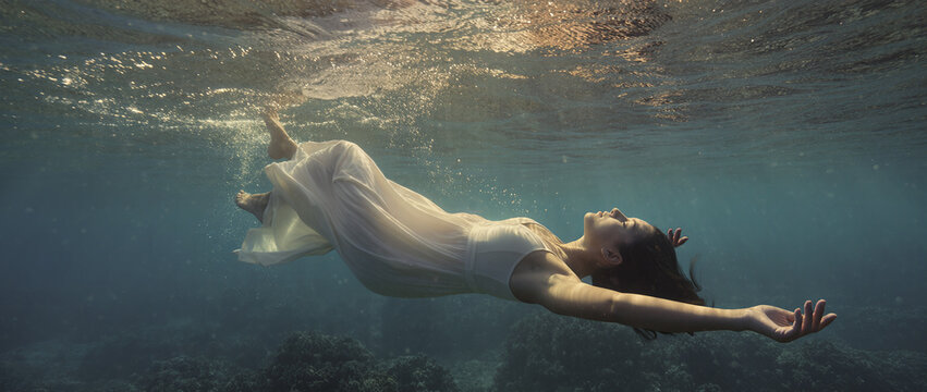 young woman swimming in the sea