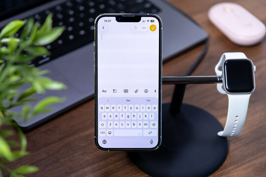 Poznan, Poland - July 29, 2025: Apple iPhone showcasing Notes app with ios 26 and Liquid Glass keyboard interface, for modern digital productivity