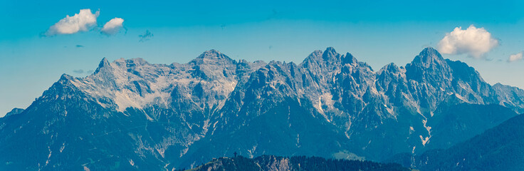 Alpine summer view with the Jacob cross and the Loferer Steinberge mountains in the background at Mount Streuboeden, Fieberbrunn, Kitzbuehel, Tyrol, Austria
