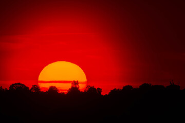Obraz premium Summer sunset or sundowner view with a dramatic sky near Osterhofen, Deggendorf, Bavaria, Germany